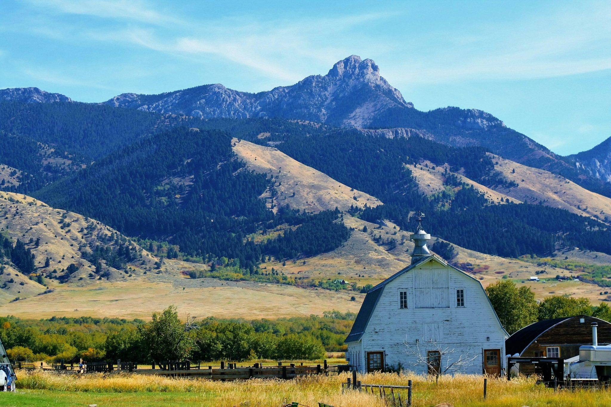 white barn in mountainscape bozeman montana